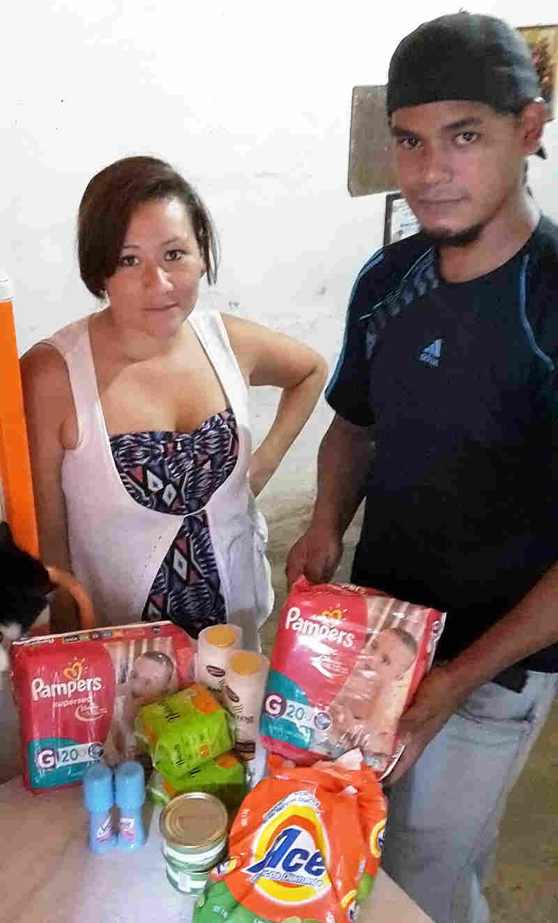 Anny Valero and Yossmy Benaventi came away from a recent shopping trip with sardines, diapers, detergent and a few other items. They had to produce their son's birth certificate to prove the baby was theirs and that they really did need the diapers.