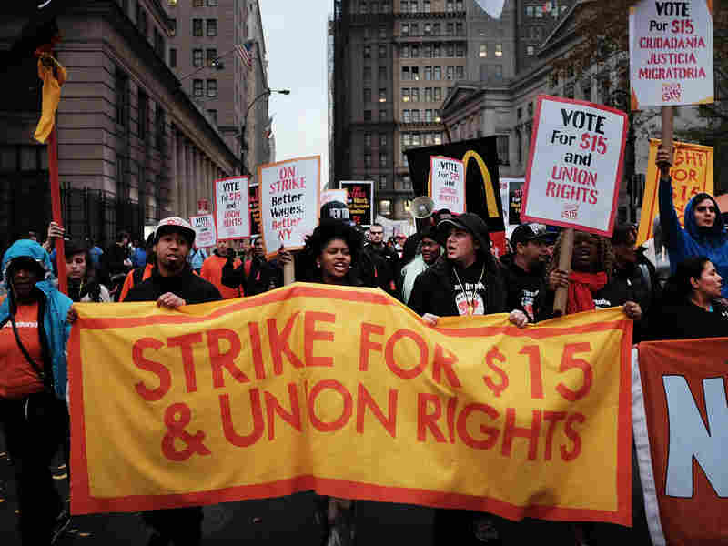 Low-wage workers and supporters protest for a $15 an hour minimum wage Tuesday in New York City as part of what organizers called a National Day of Action.