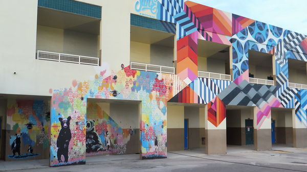The walls at Eneida Hartner Elementary are now covered in art, including murals by Dutch artist duo Pipsqueak was here!!! and Holland-based David Junelouf.